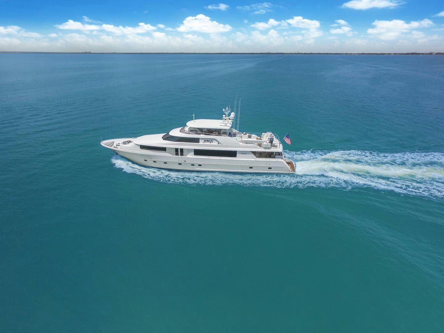 a white boat in the water aboard NAUTI N' Yacht for Sale