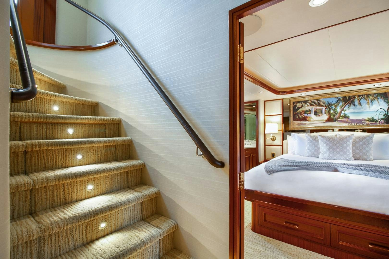 a bed with a wood frame aboard NAUTI N' Yacht for Sale