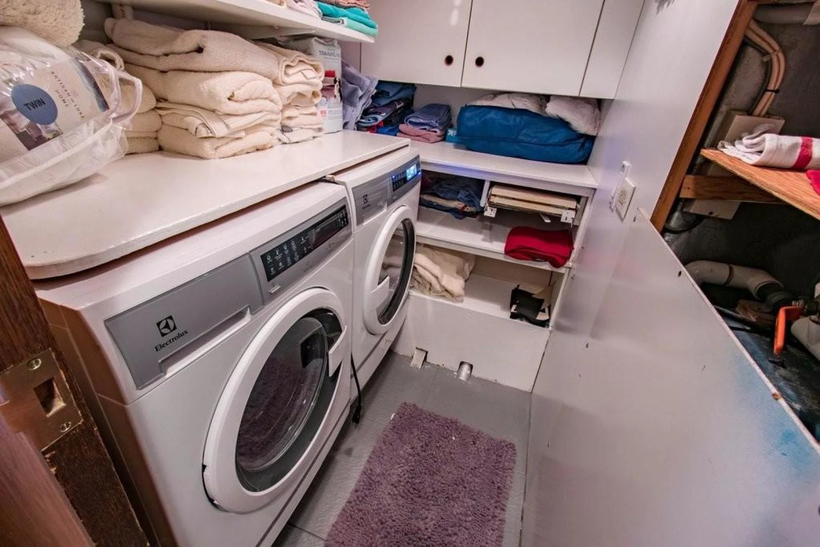 a laundry machine in a kitchen aboard TIMELESS Yacht for Sale