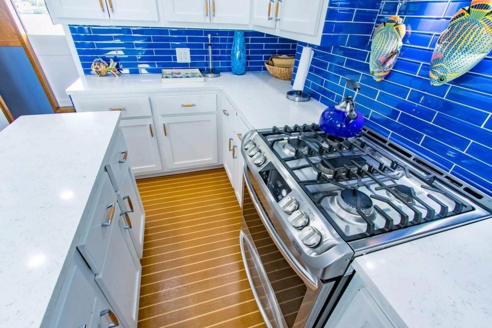 a kitchen with white cabinets aboard TIMELESS Yacht for Sale