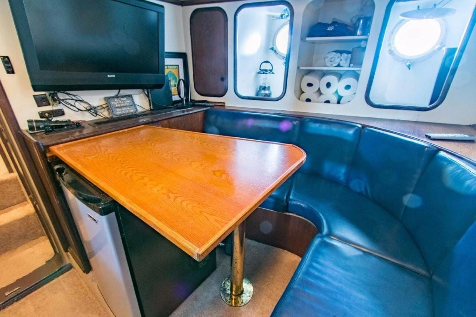 a table with a tv and a machine on it aboard TIMELESS Yacht for Sale