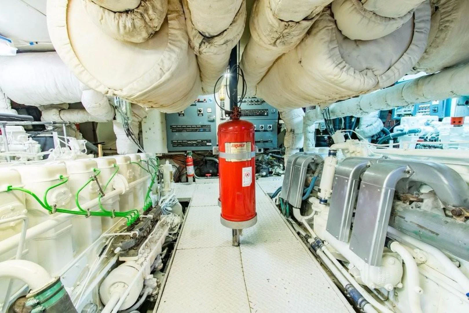 a red canister in a large room with a large white object aboard TIMELESS Yacht for Sale