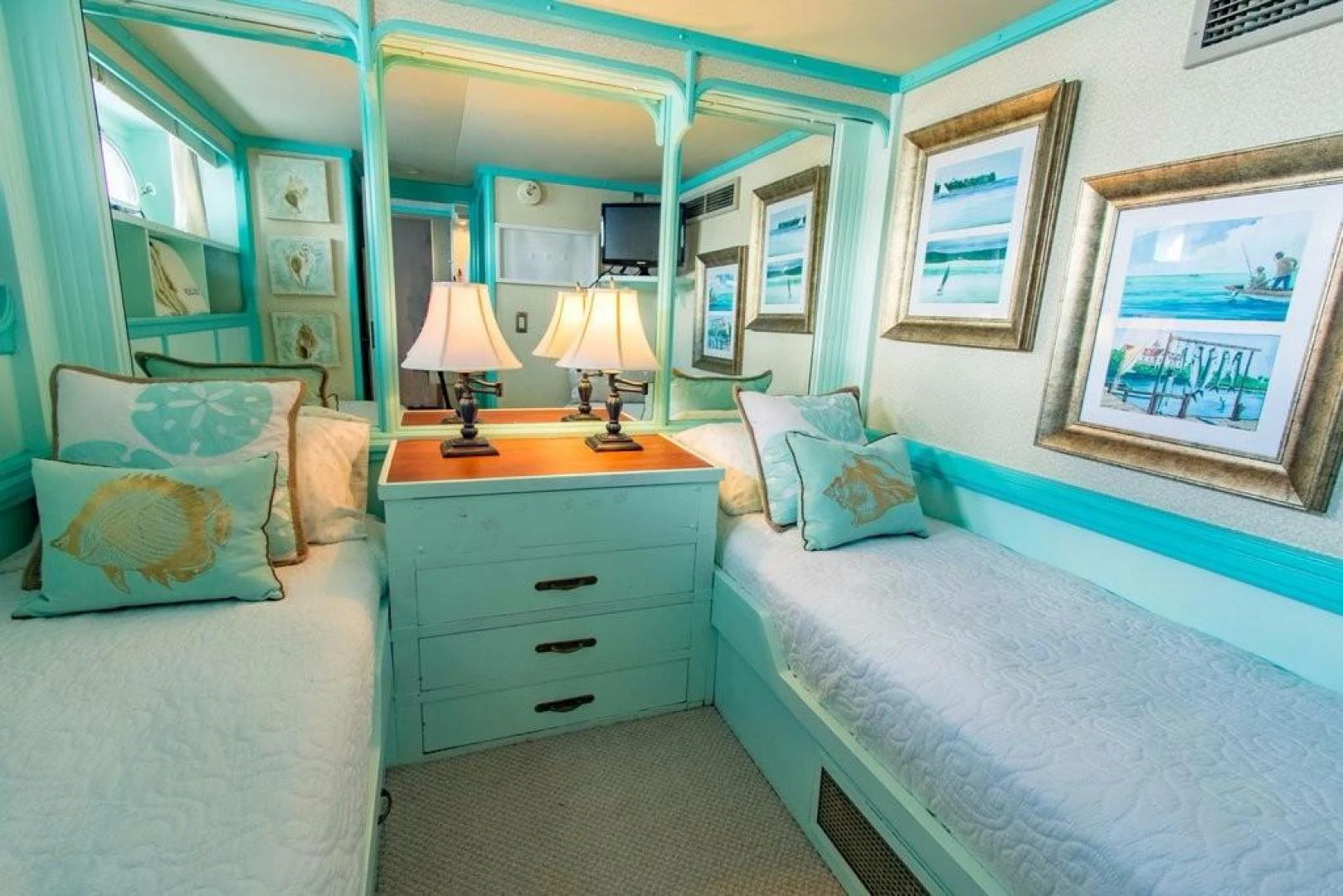 a bedroom with a bed and a desk aboard TIMELESS Yacht for Sale