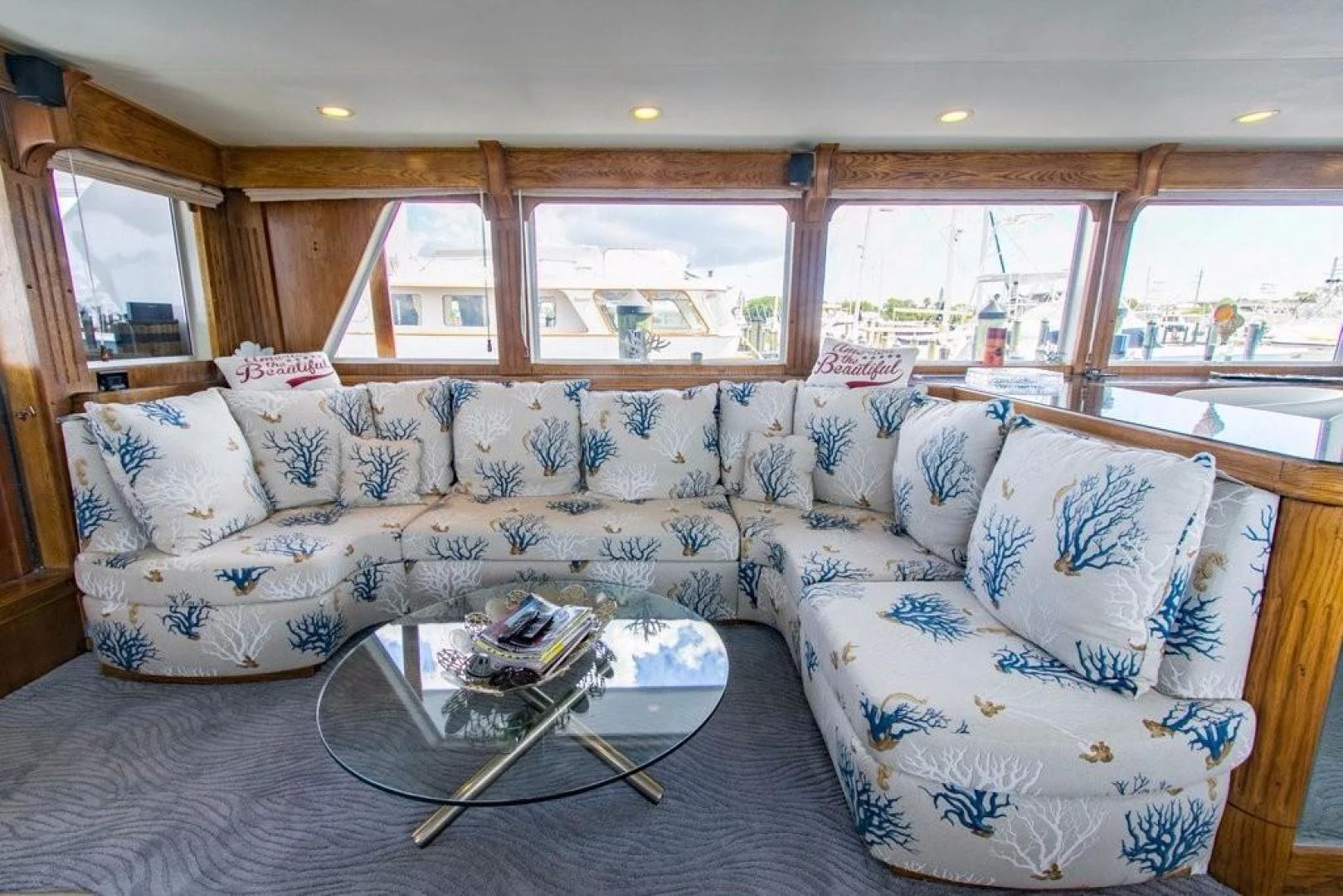 a living room with a couch aboard TIMELESS Yacht for Sale
