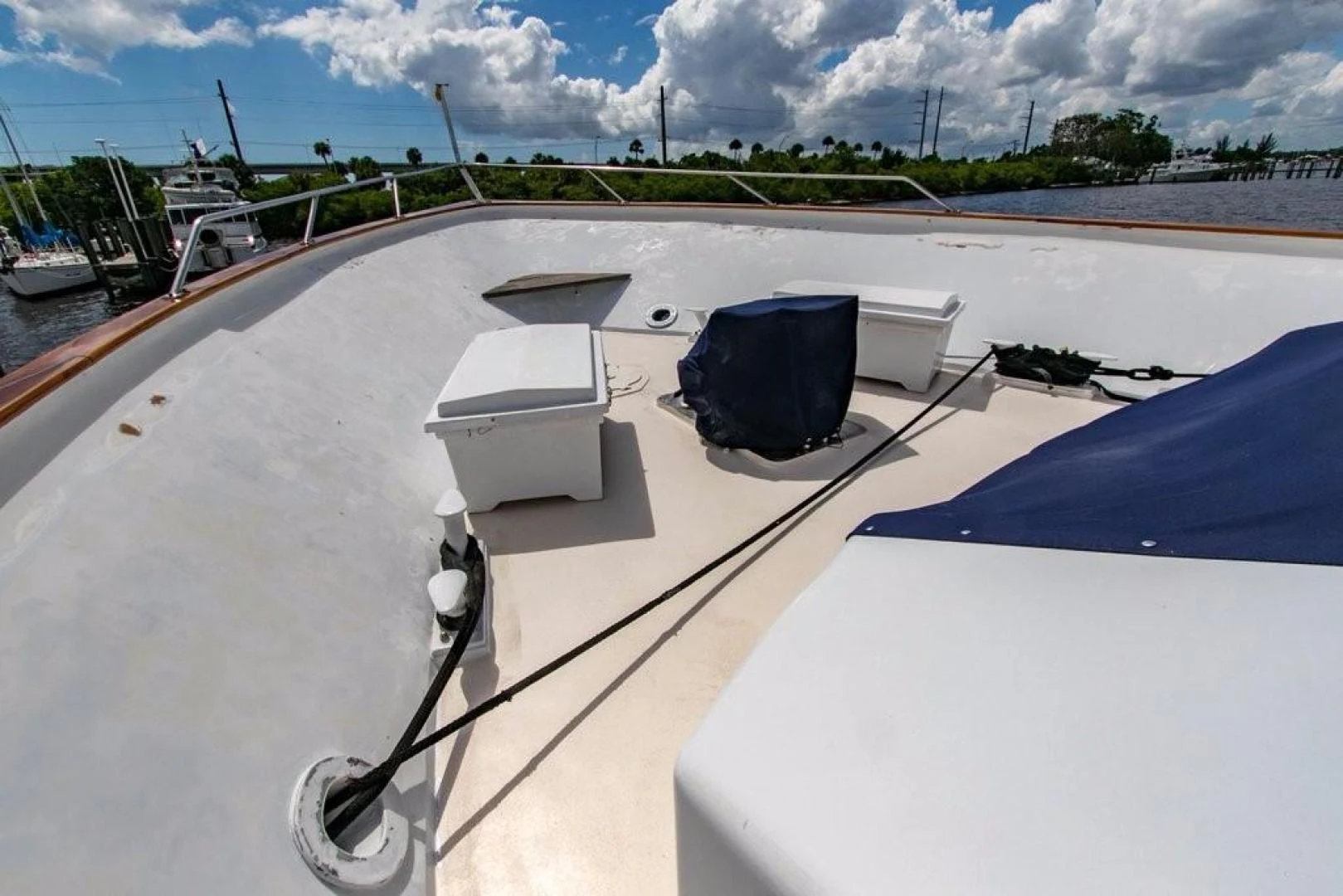 a deck with a chair and a table on it aboard TIMELESS Yacht for Sale