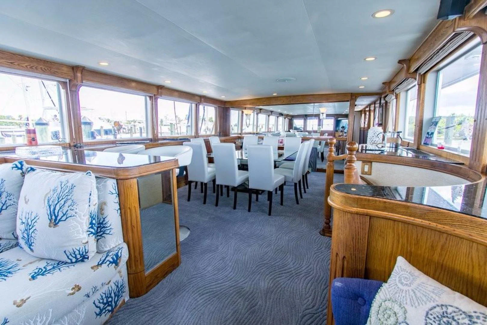 a large living room with a large window aboard TIMELESS Yacht for Sale