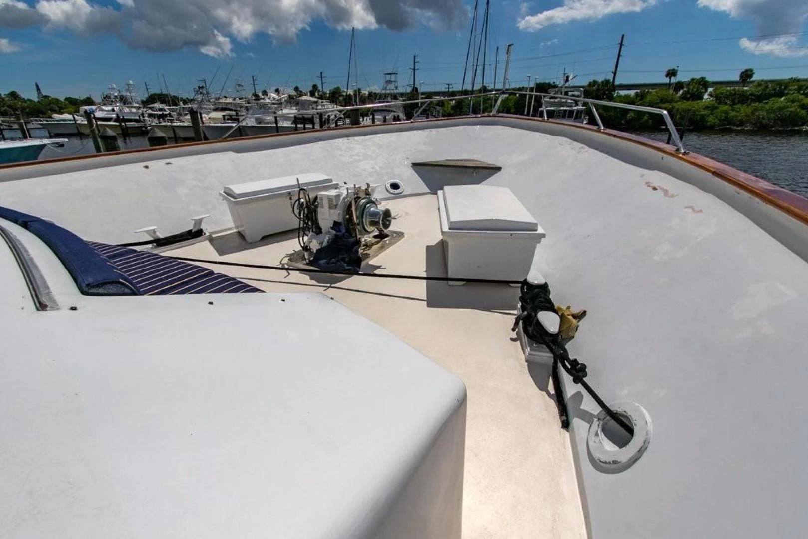 a boat with a chair on the deck aboard TIMELESS Yacht for Sale