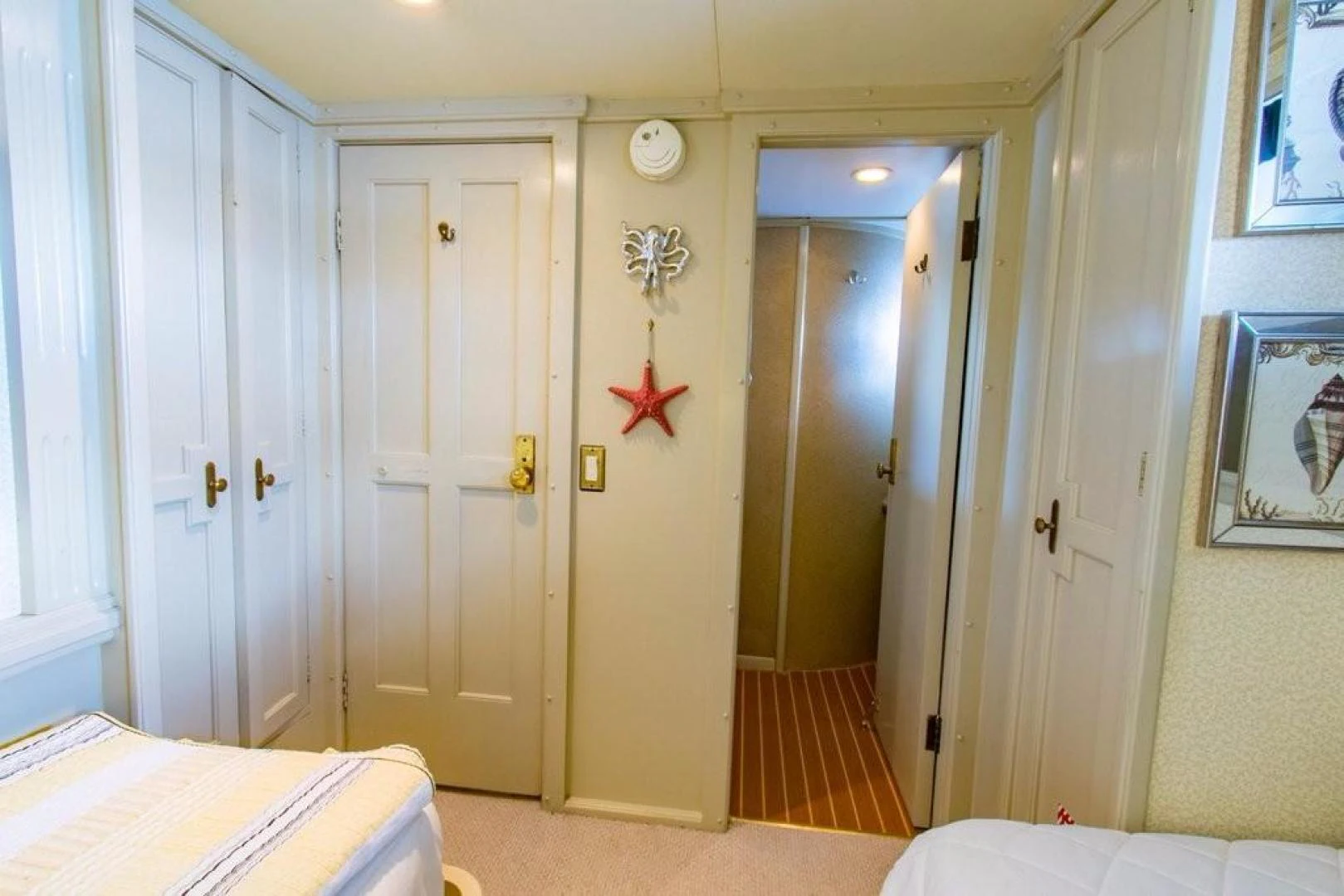 a bedroom with a door and a bed aboard TIMELESS Yacht for Sale