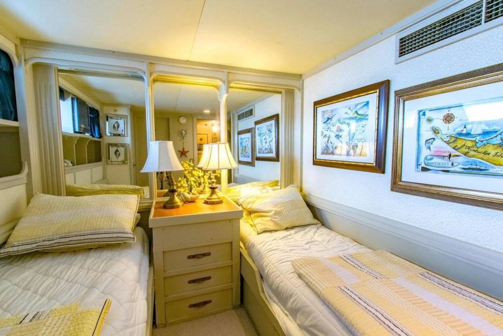 a bedroom with a bed and a mirror aboard TIMELESS Yacht for Sale