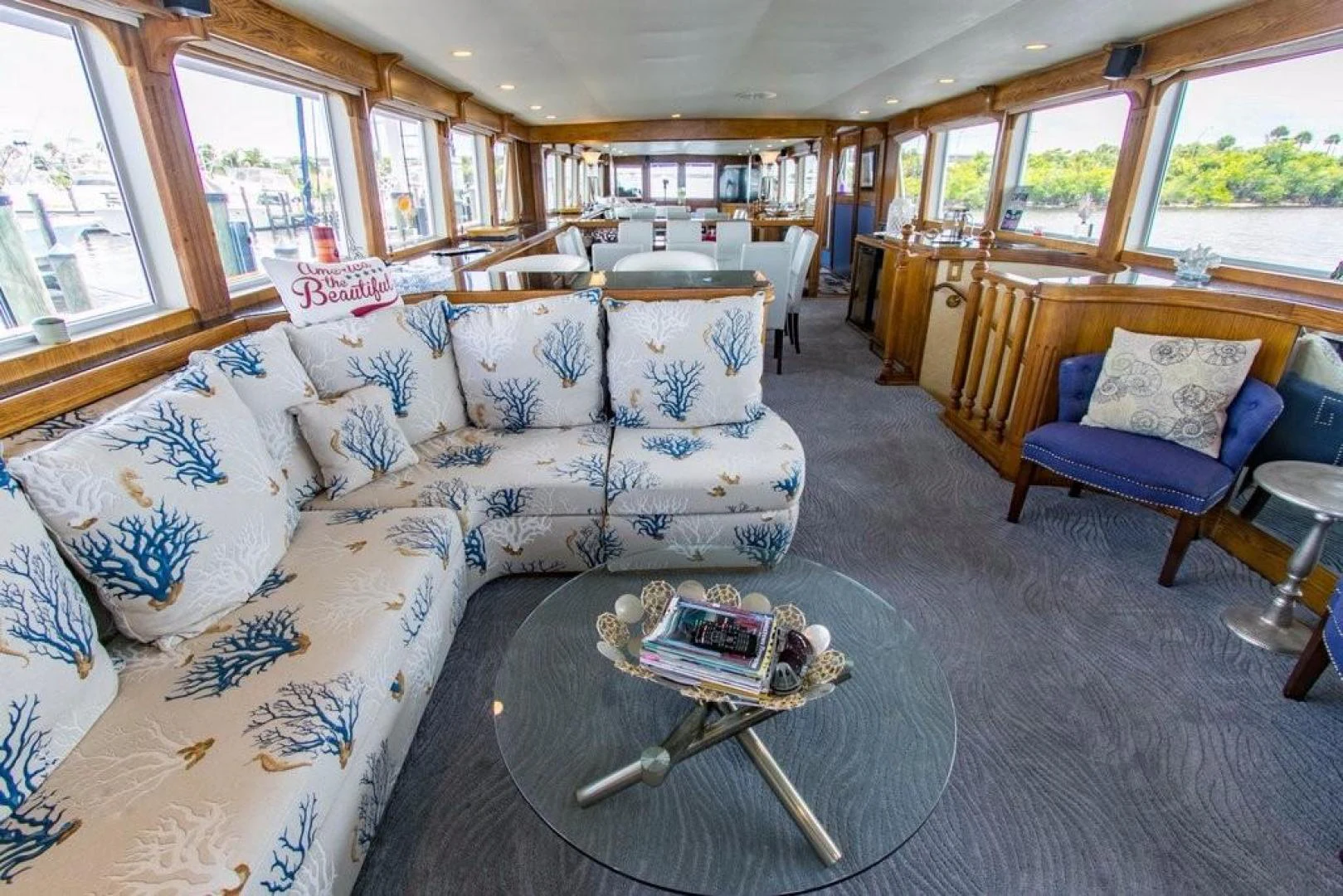 a living room with couches and a coffee table aboard TIMELESS Yacht for Sale