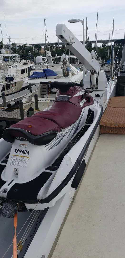 a white and red boat aboard TIMELESS Yacht for Sale