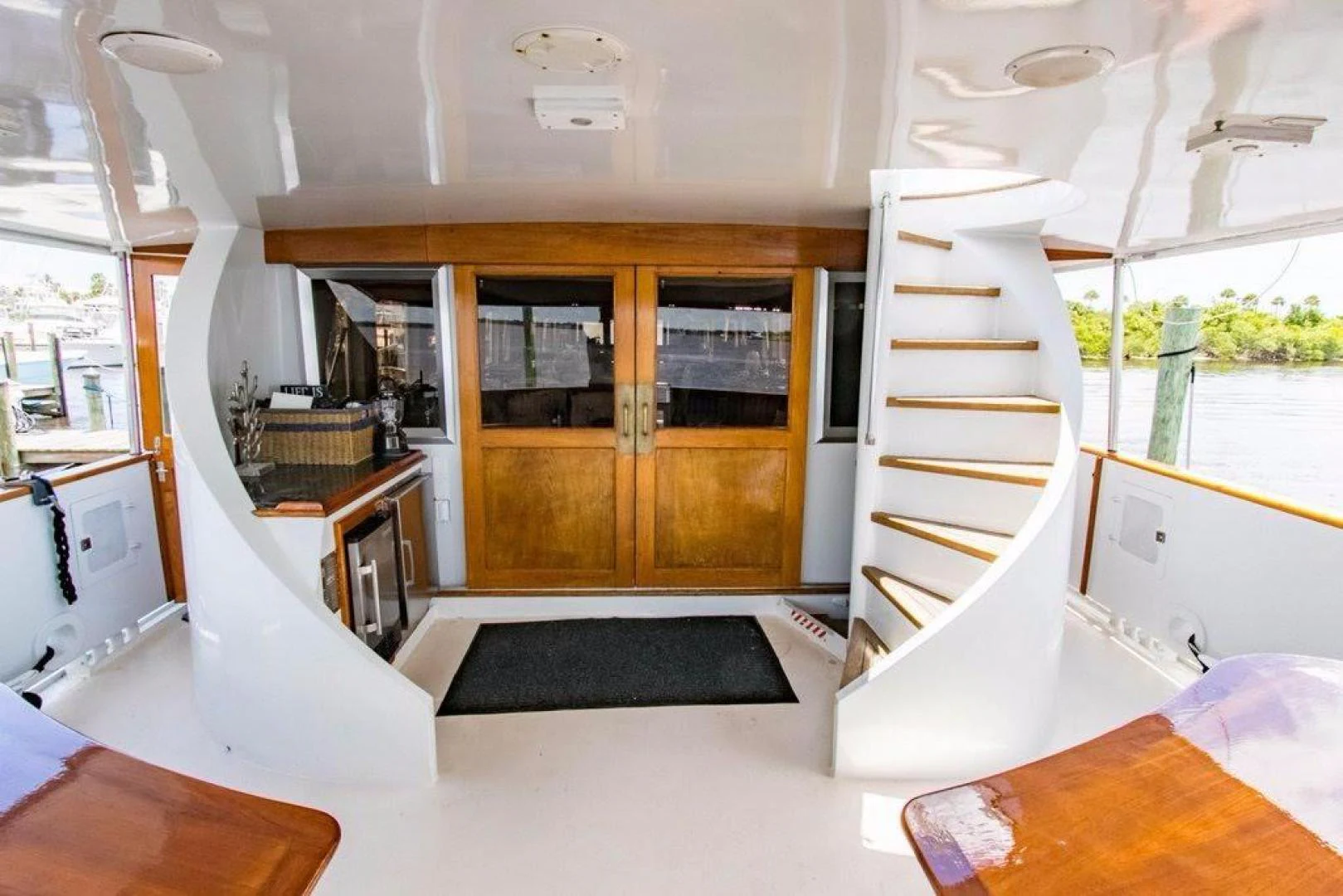 a room with a staircase and a glass door aboard TIMELESS Yacht for Sale