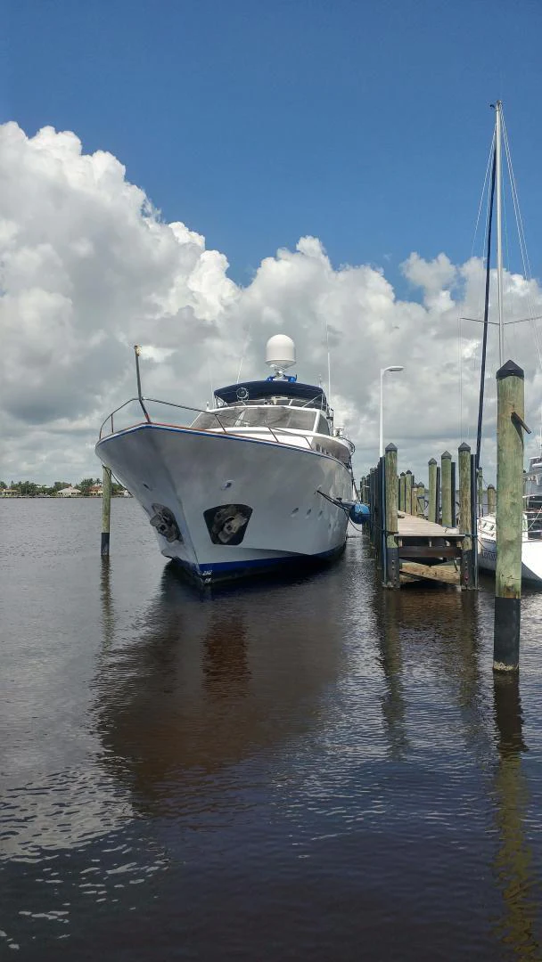 a boat docked at a pier aboard TIMELESS Yacht for Sale