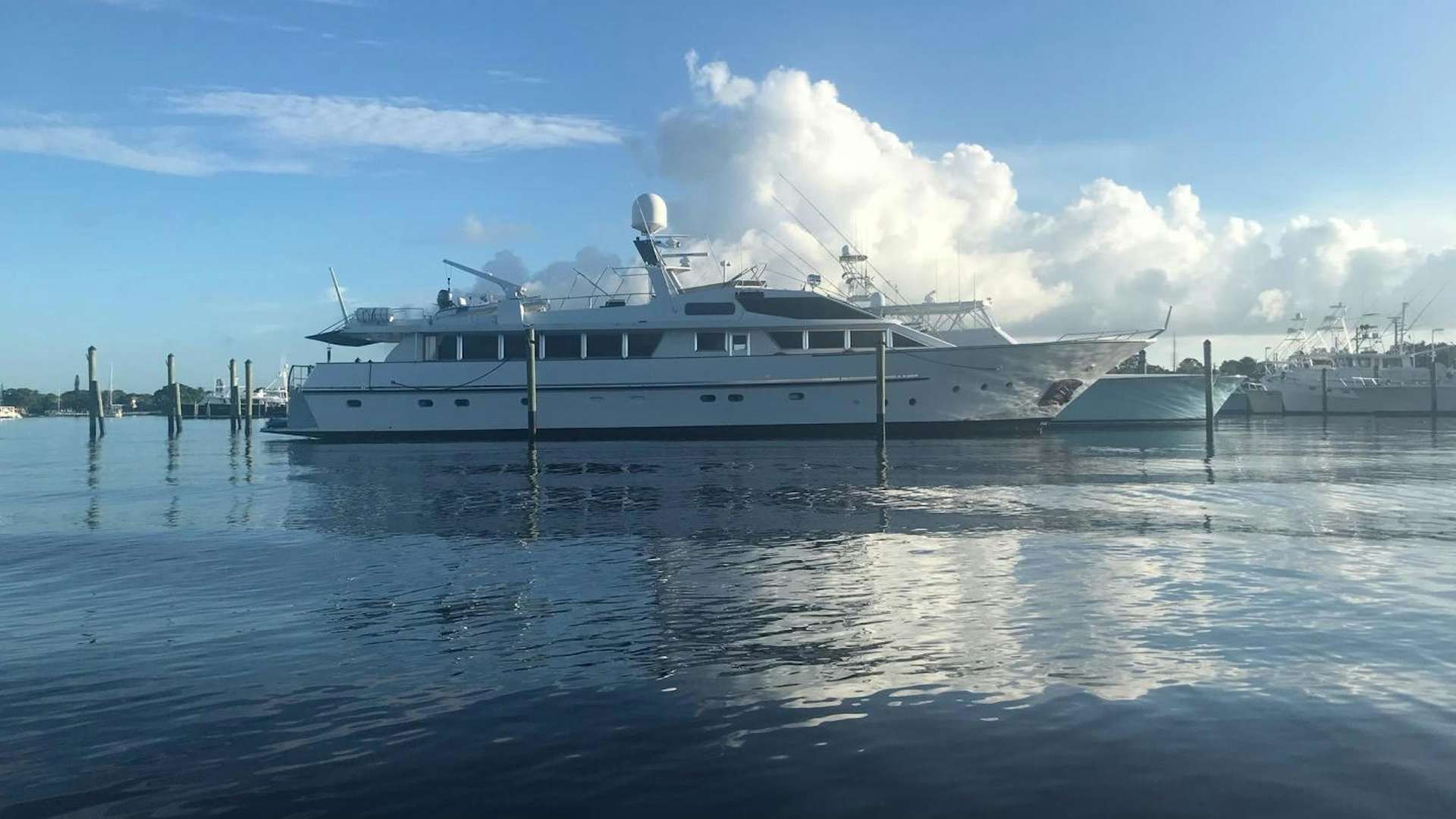 a large white boat on the water aboard TIMELESS Yacht for Sale