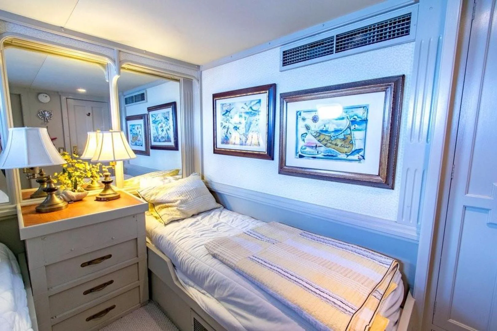 a bedroom with a painting on the wall aboard TIMELESS Yacht for Sale