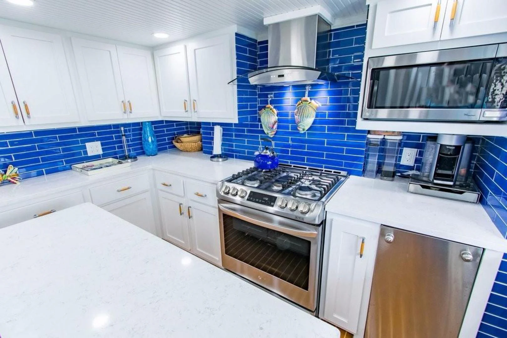 a kitchen with white cabinets aboard TIMELESS Yacht for Sale
