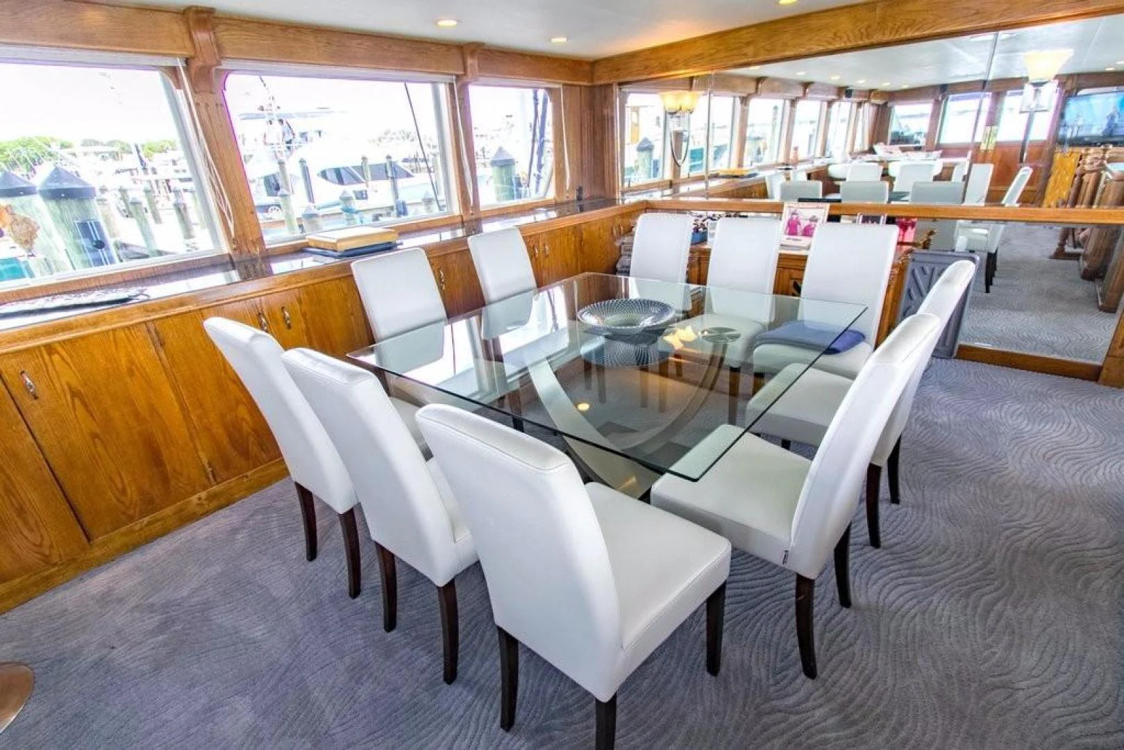 a room with a table and chairs aboard TIMELESS Yacht for Sale