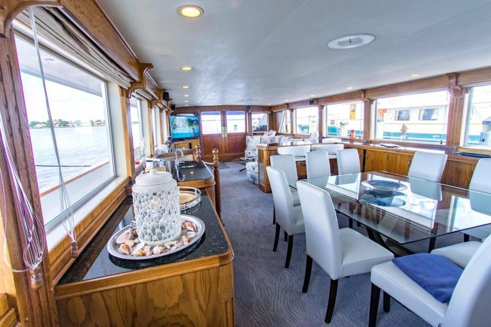 a large dining room with a large table and chairs aboard TIMELESS Yacht for Sale