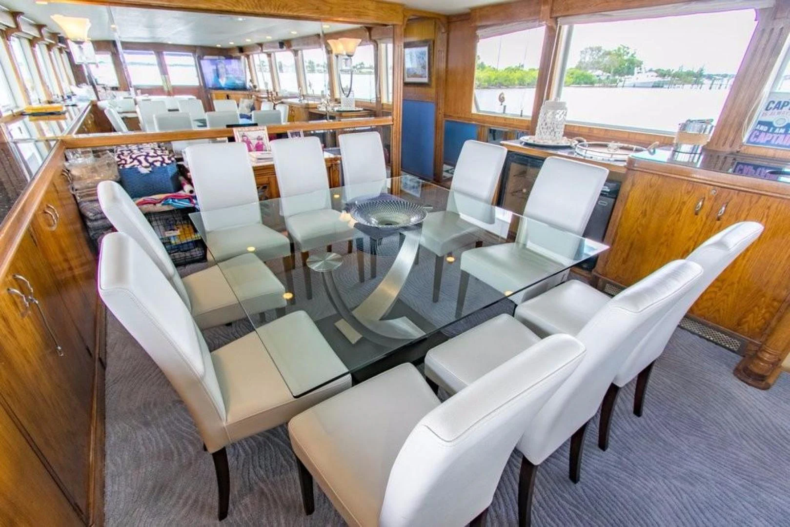 a room with a table chairs and a window aboard TIMELESS Yacht for Sale