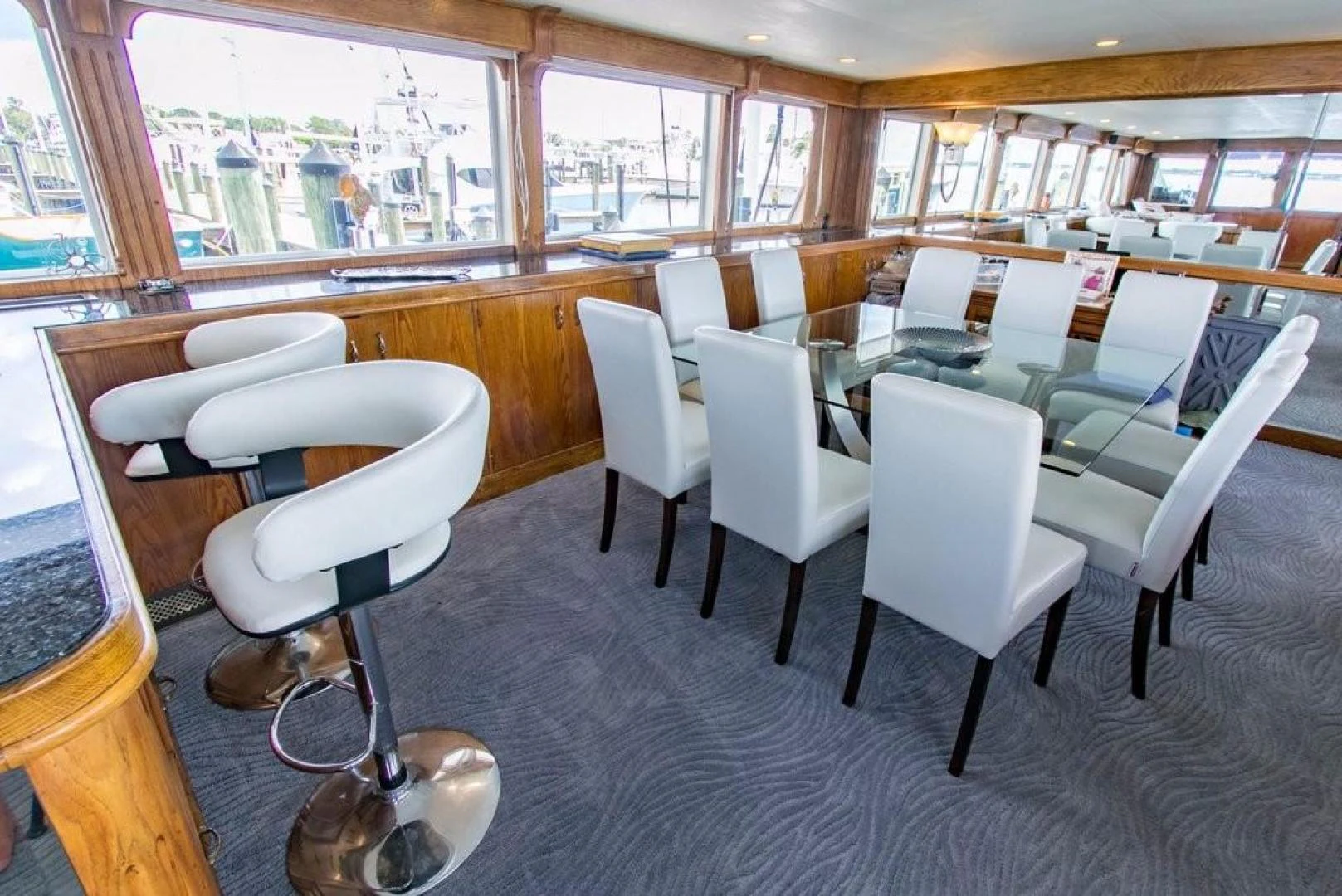 a room with a table chairs and a window aboard TIMELESS Yacht for Sale
