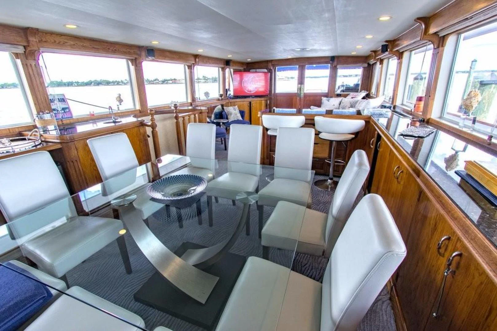 a train car with tables and chairs aboard TIMELESS Yacht for Sale