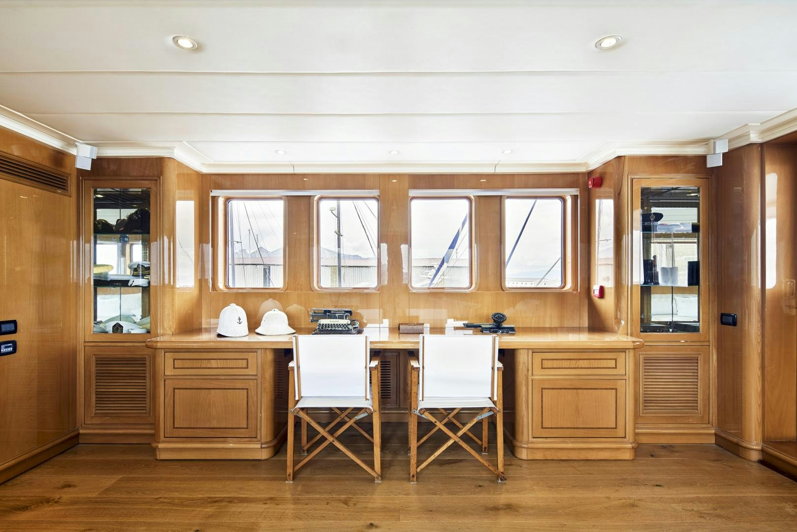 a kitchen with a table and chairs aboard OLDE SALT Yacht for Sale