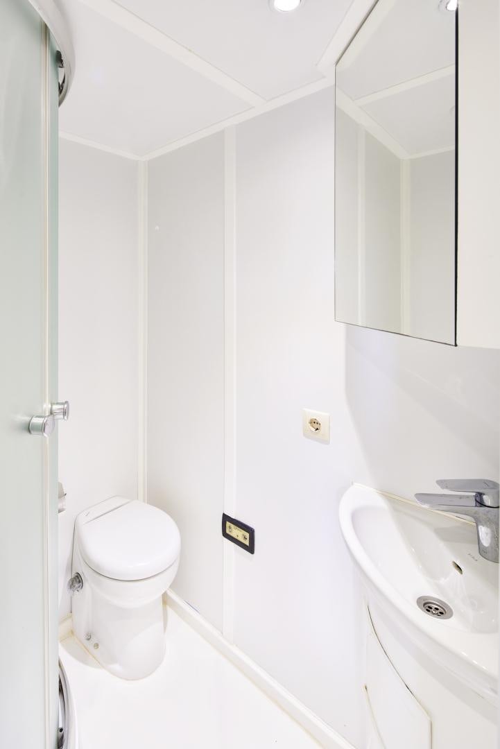 a bathroom with a toilet and sink aboard OLDE SALT Yacht for Sale