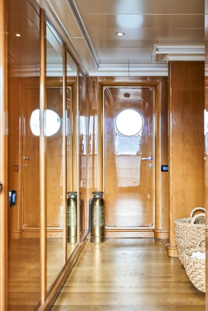 a room with wood walls and a wood door aboard OLDE SALT Yacht for Sale