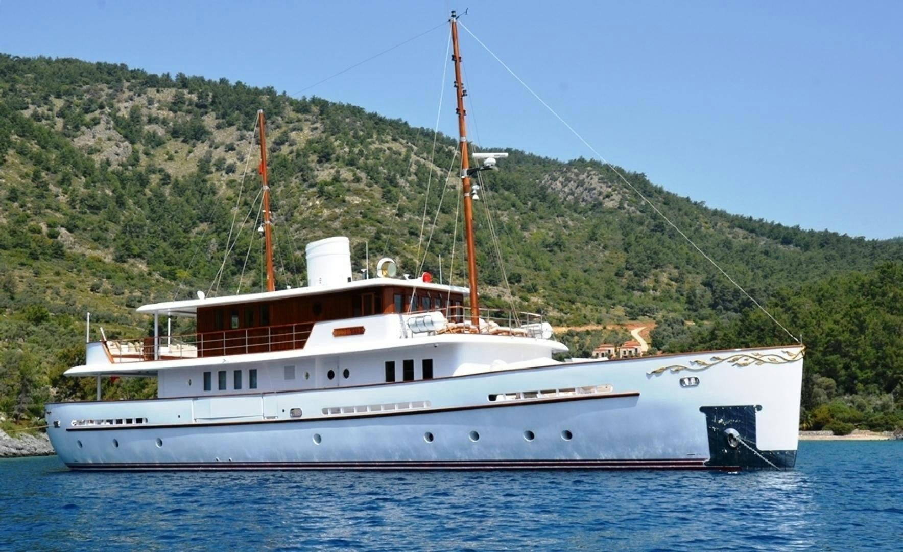 a large white boat on the water aboard OLDE SALT Yacht for Sale