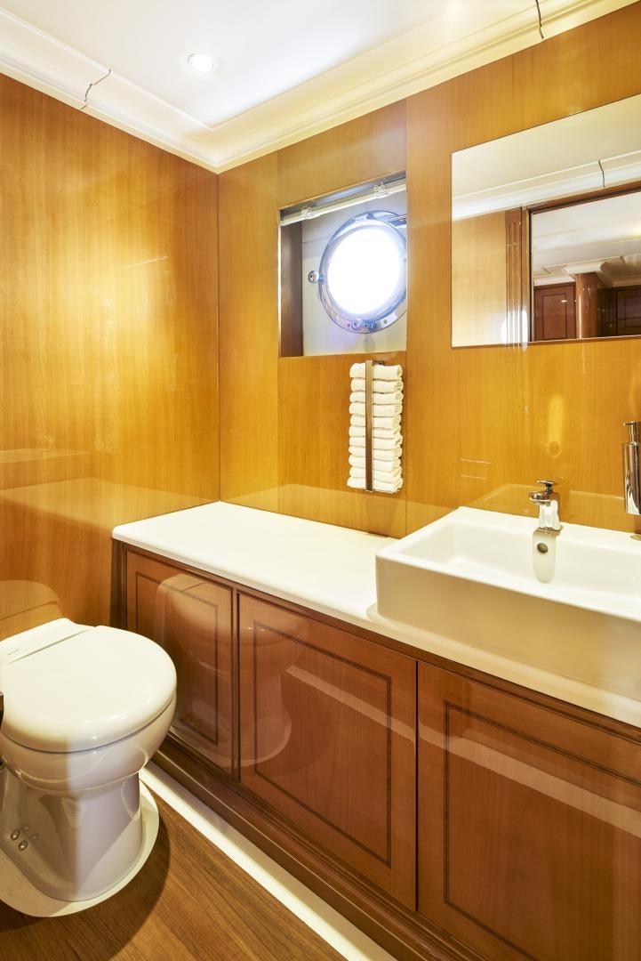 a bathroom with a toilet and a sink aboard OLDE SALT Yacht for Sale