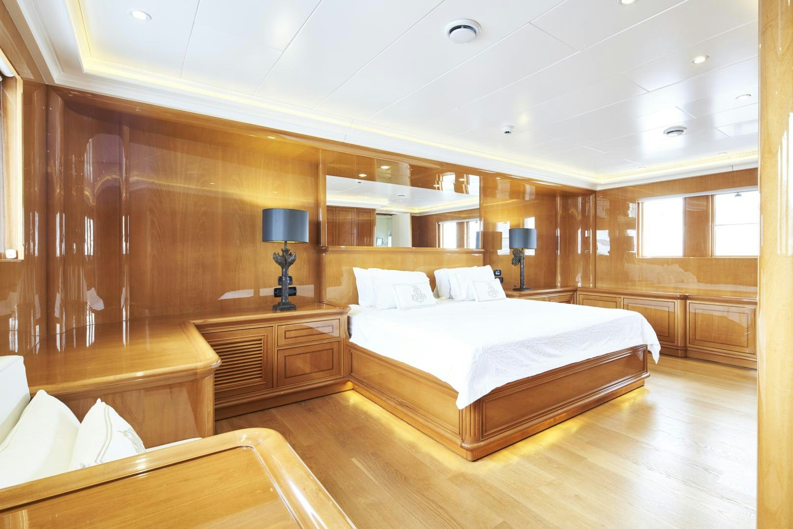 a room with a bed and a lamp aboard OLDE SALT Yacht for Sale