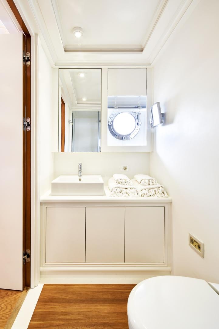 a bathroom with a sink and a mirror aboard OLDE SALT Yacht for Sale