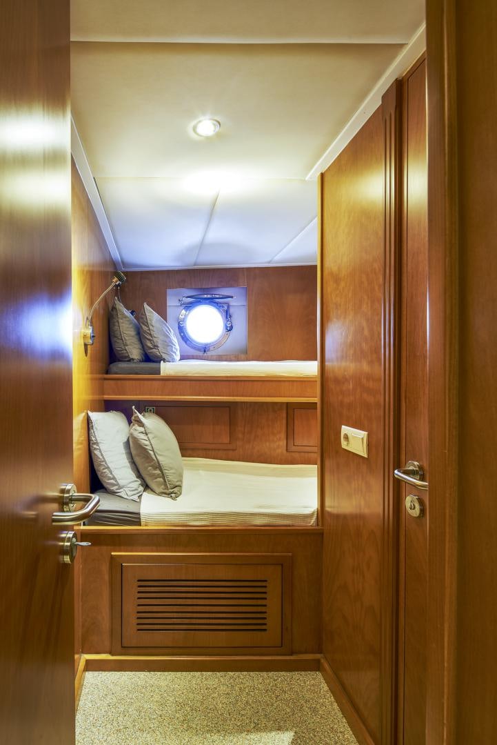 a wooden closet with a mirror above it aboard OLDE SALT Yacht for Sale