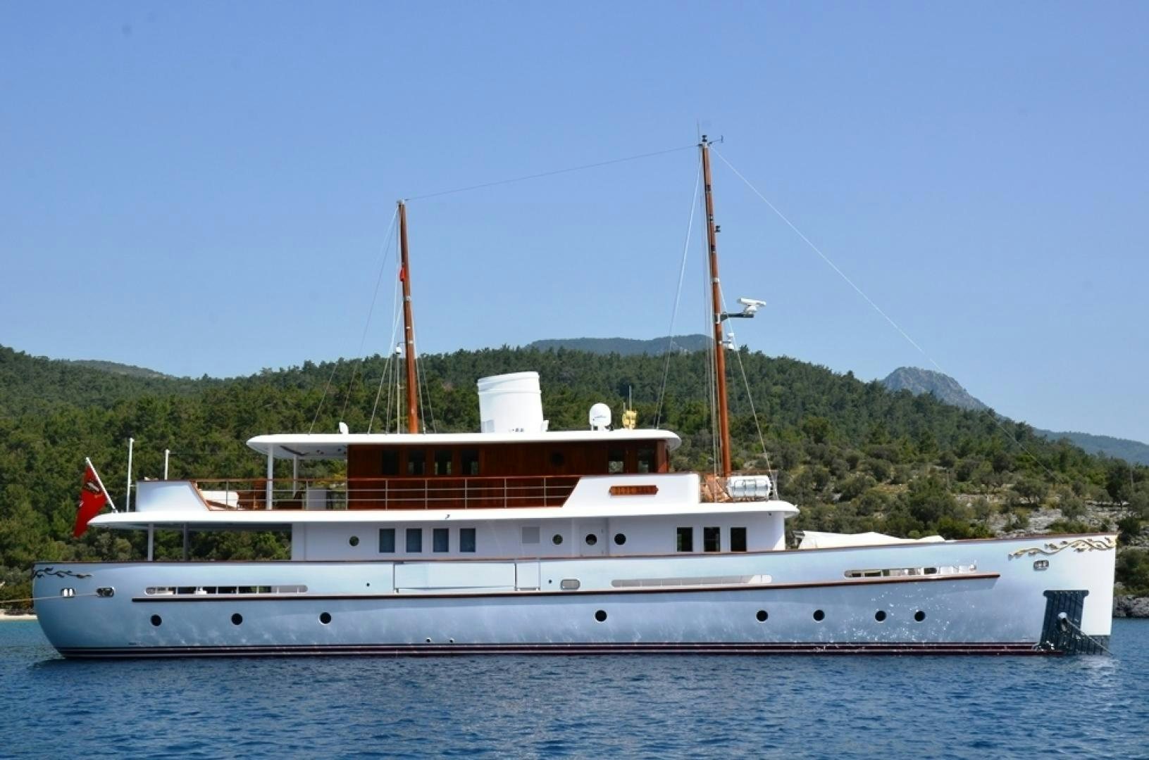 a large white boat on the water aboard OLDE SALT Yacht for Sale