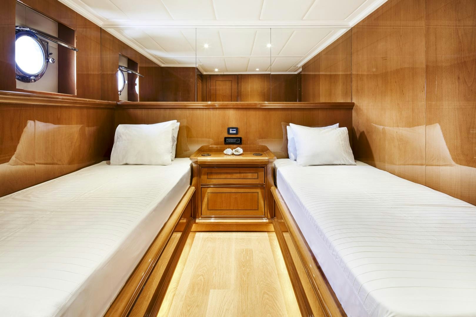 a room with beds and a table aboard OLDE SALT Yacht for Sale