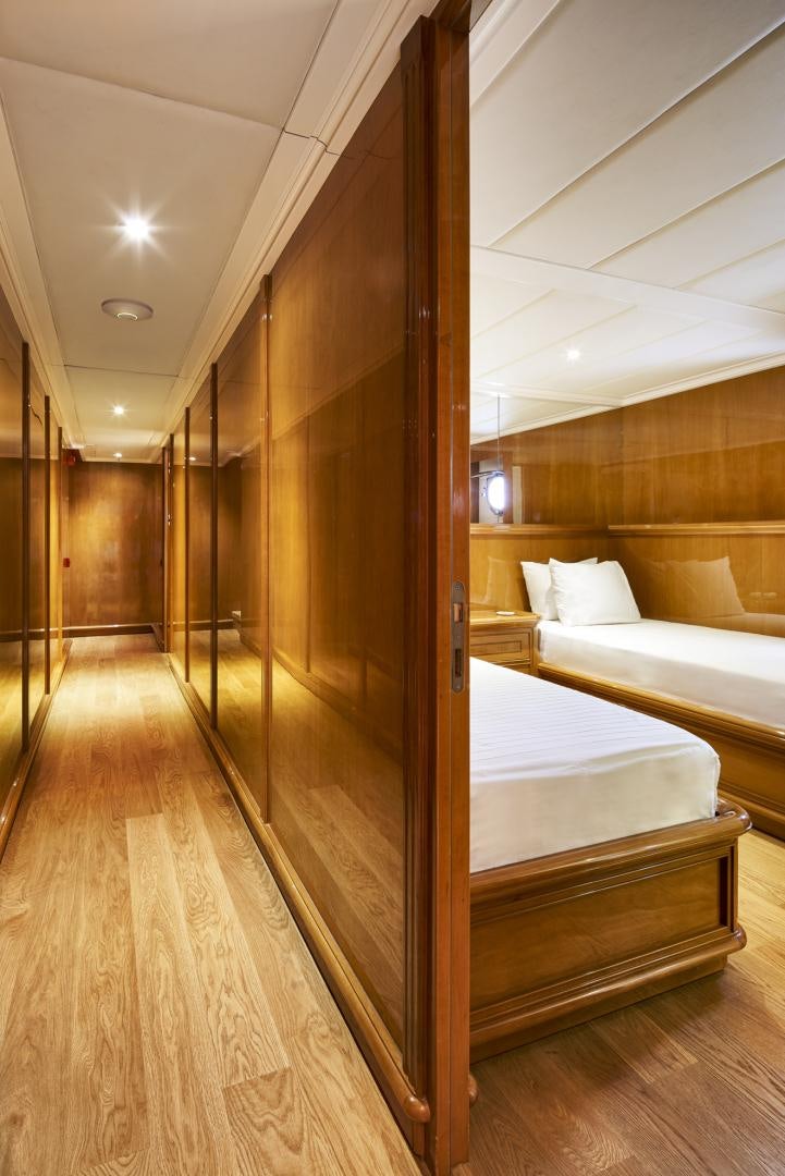 a room with a bed and a mirror aboard OLDE SALT Yacht for Sale