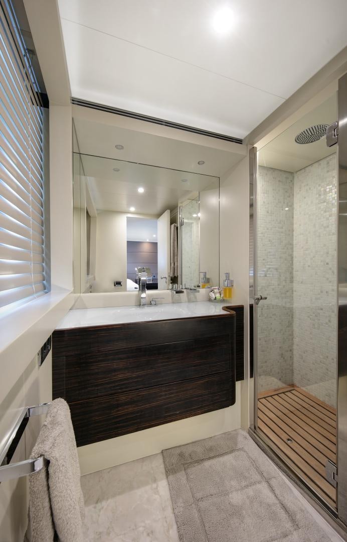 a bathroom with a large mirror aboard Y42 Yacht for Sale