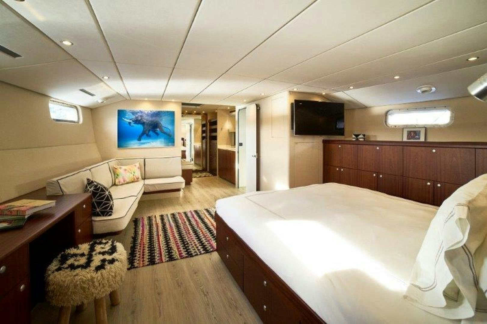 a bedroom with a bed and a tv aboard ICEBERG Yacht for Sale