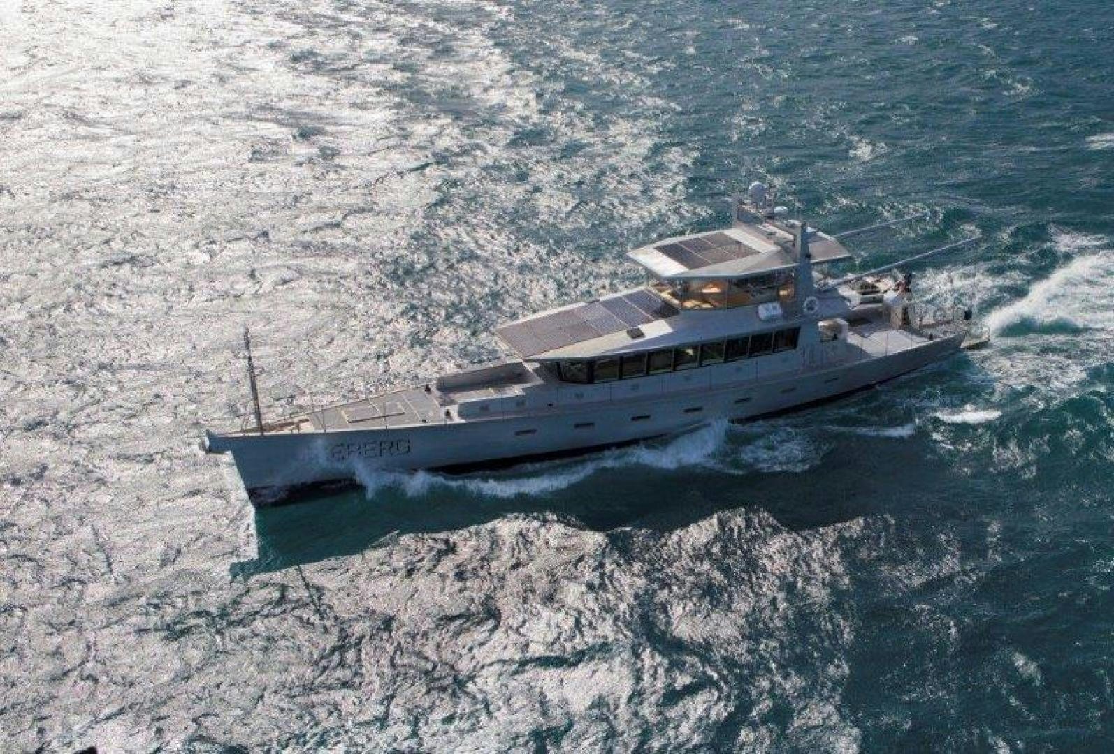a helicopter flying over a city aboard ICEBERG Yacht for Sale