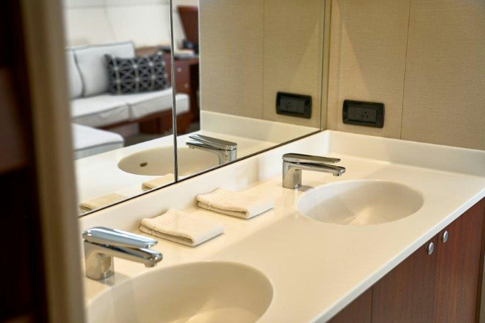 a bathroom with a sink and a mirror aboard ICEBERG Yacht for Sale