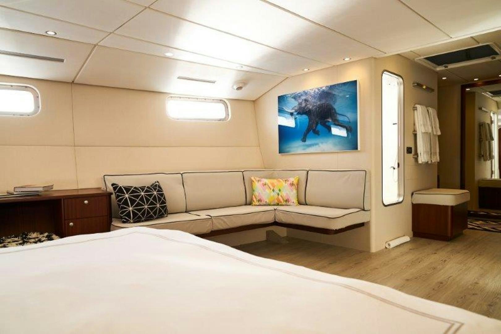 a room with a bed and a couch aboard ICEBERG Yacht for Sale