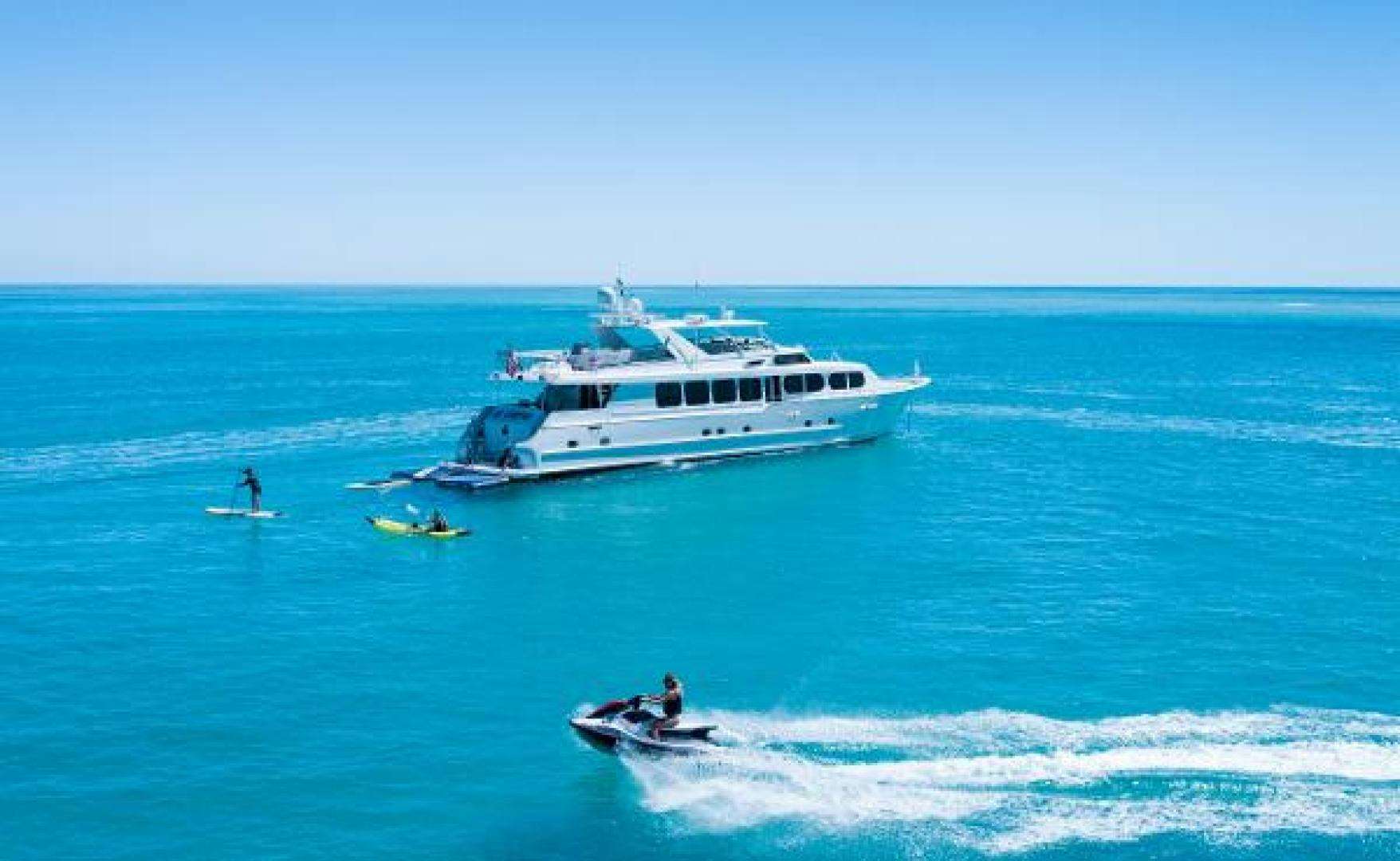 a boat and a couple people in the water aboard IL CAPO Yacht for Sale