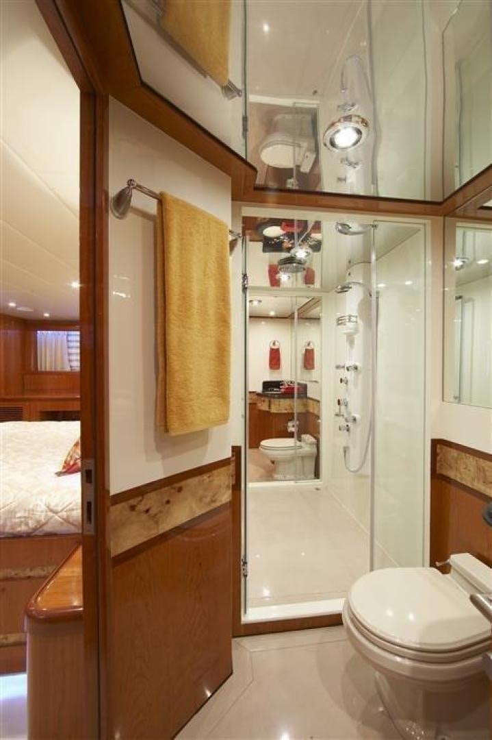 a bathroom with a shower and toilet aboard JOHNSON 110 SKYLOUNGE Yacht for Sale