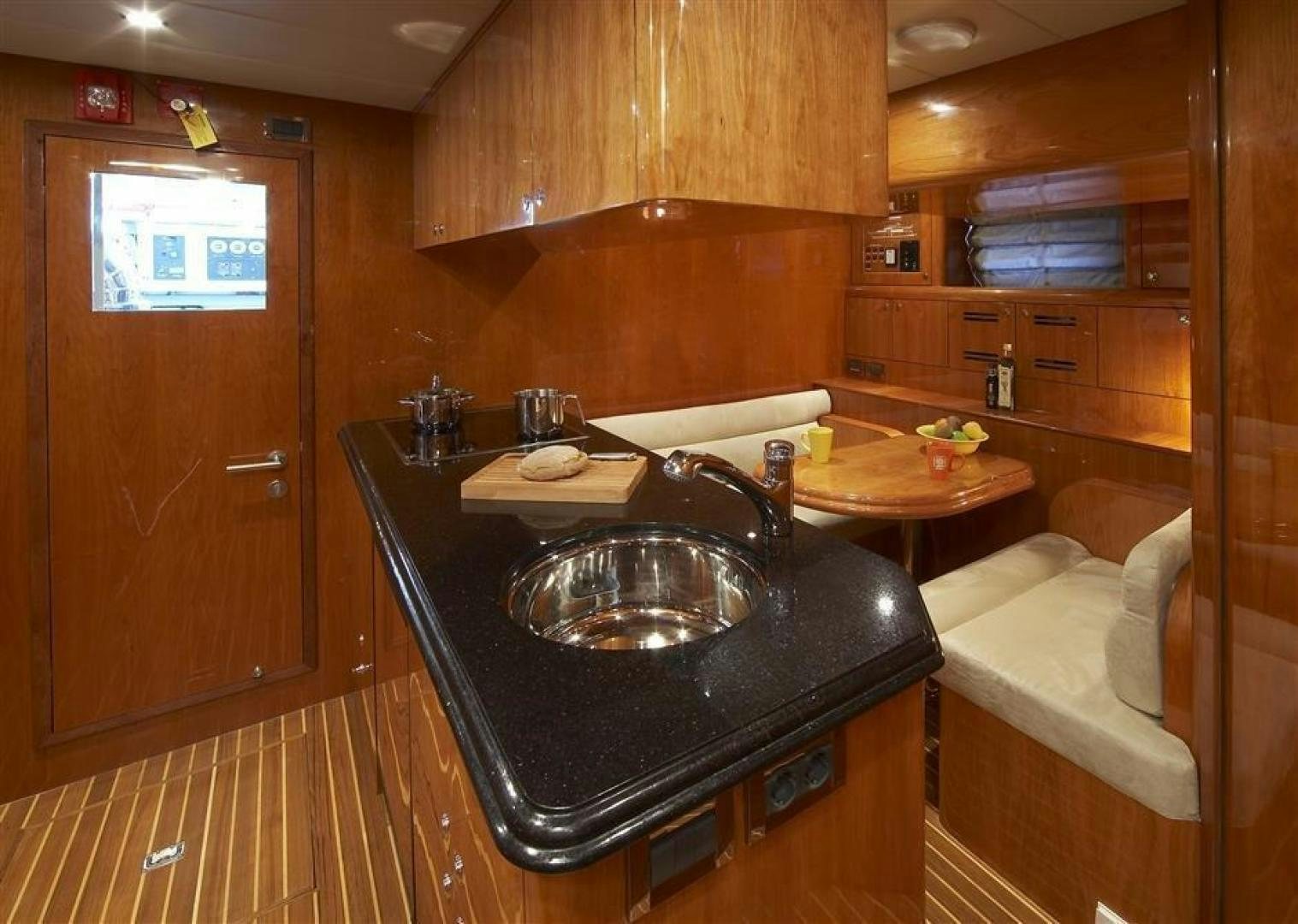 a kitchen with a sink and a counter aboard JOHNSON 110 SKYLOUNGE Yacht for Sale