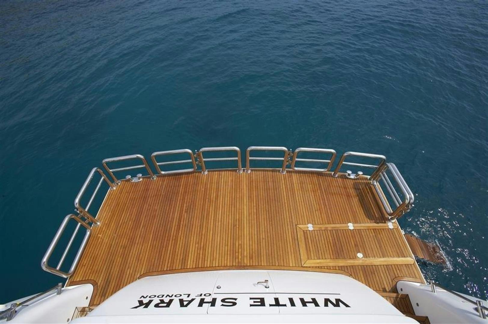 a boat on the water aboard JOHNSON 110 SKYLOUNGE Yacht for Sale