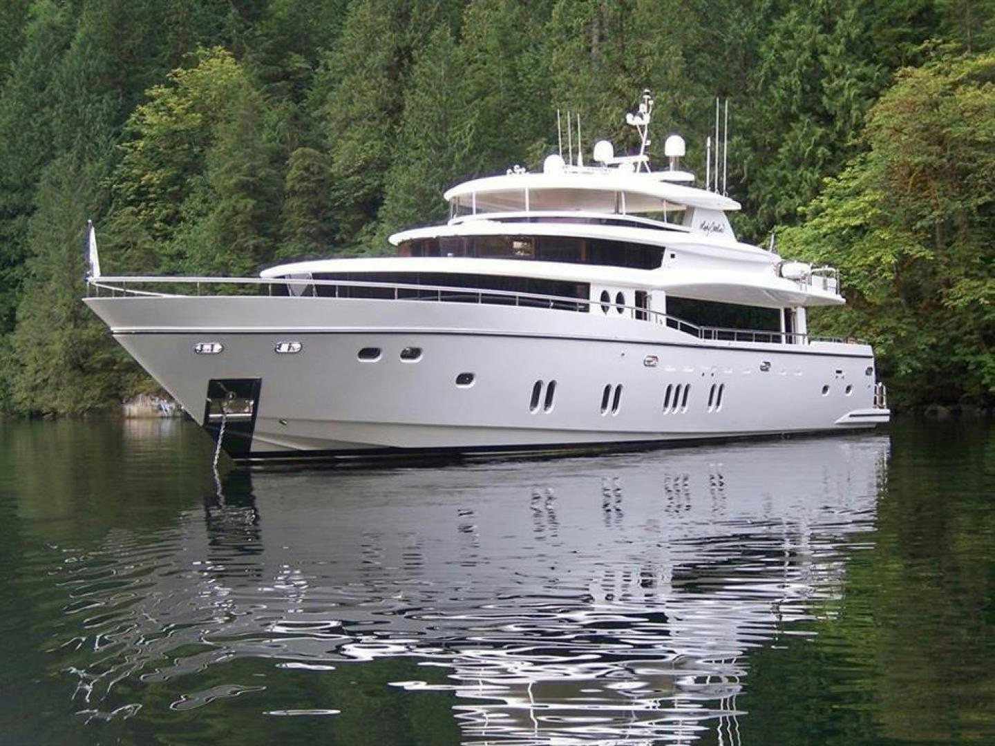 a white boat on water aboard JOHNSON 110 FLYBRIDGE Yacht for Charter
