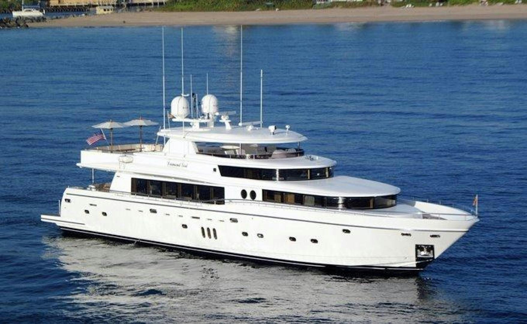 a white boat on the water aboard JOHNSON 110 FLYBRIDGE Yacht for Charter