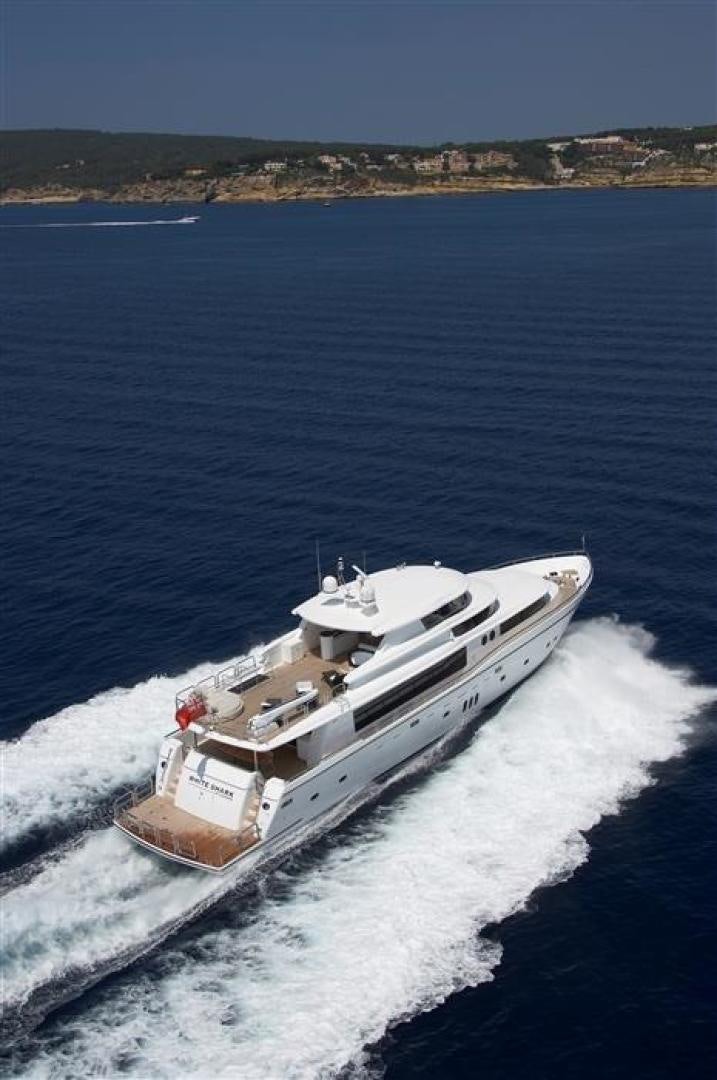 a boat on the water aboard JOHNSON 110 FLYBRIDGE Yacht for Charter