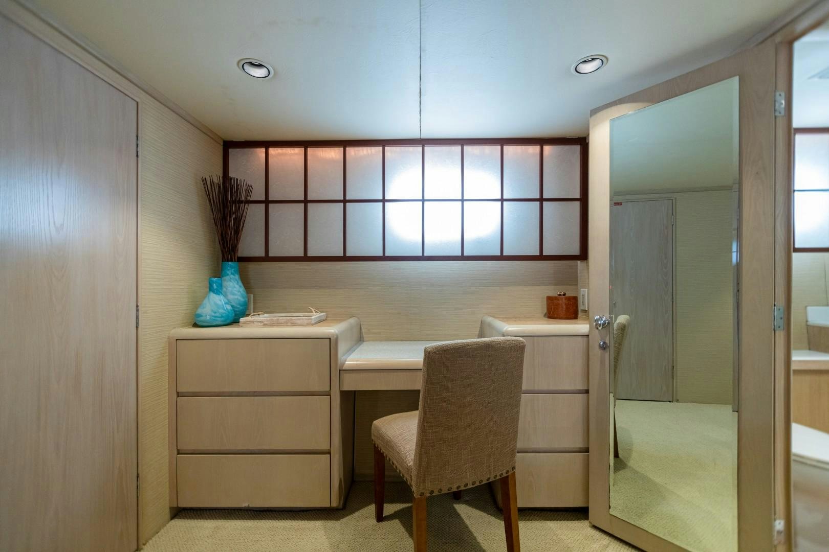 a kitchen with a desk and a chair aboard ISLAND TIME Yacht for Sale