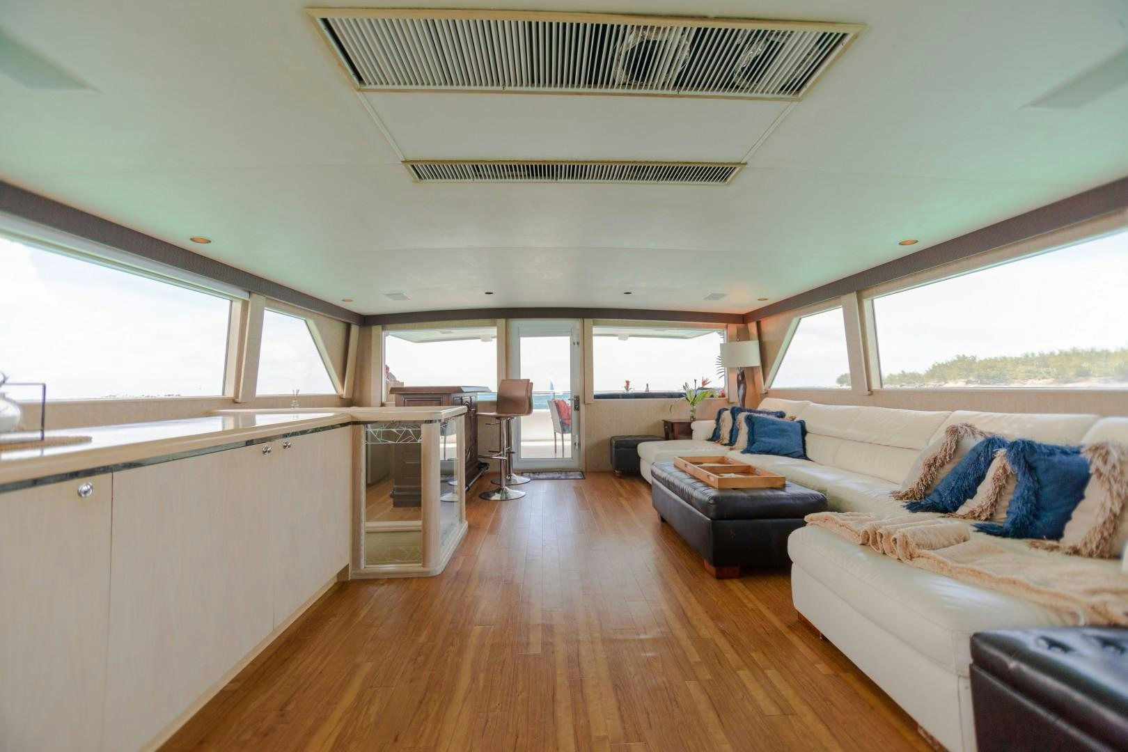 a living room with a couch and a table aboard ISLAND TIME Yacht for Sale